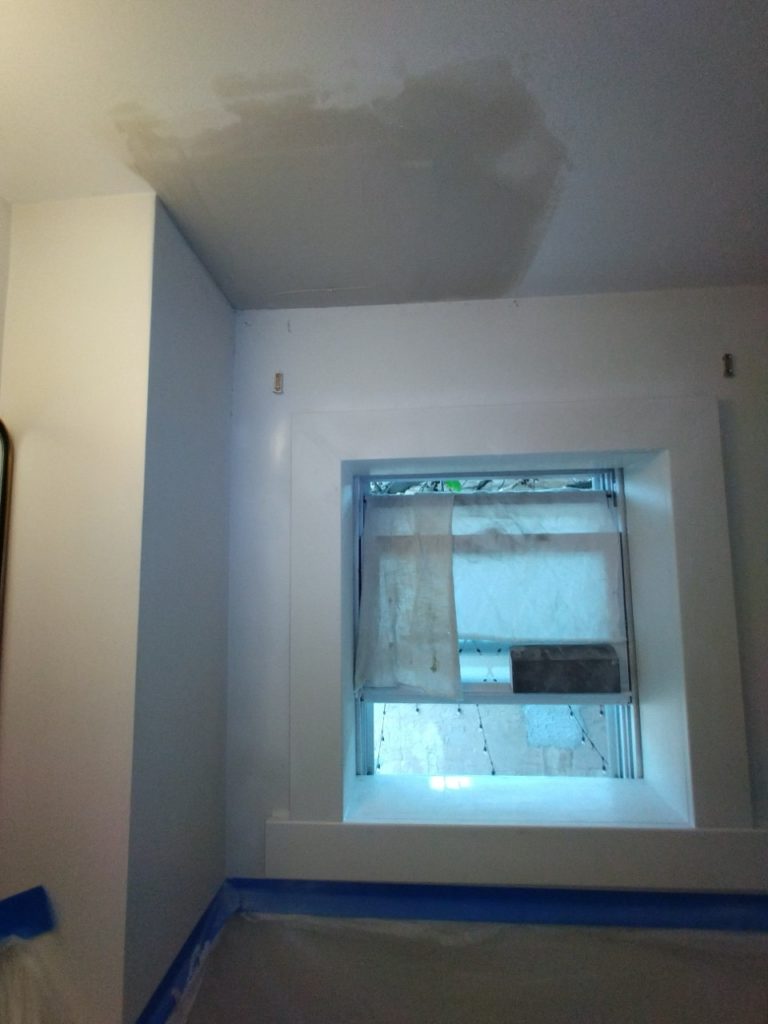 Window with new frame and ceiling patch for leak repair