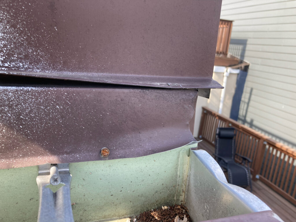 Image of loose spout that Dr. Leaks inspected on roof causing a water leak in Philly